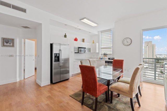 dining room with light hardwood / wood-style floors