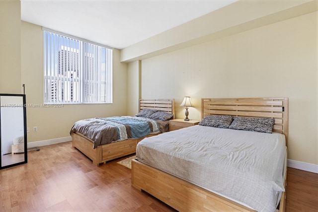 bedroom with light wood-type flooring