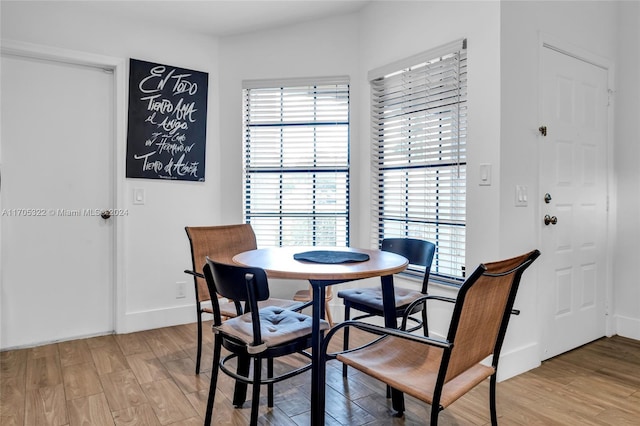 dining area with light hardwood / wood-style floors