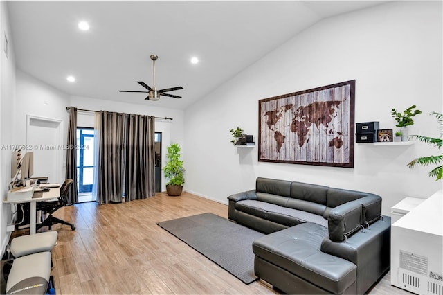 living room with light hardwood / wood-style floors, vaulted ceiling, and ceiling fan