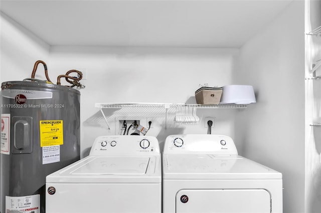 laundry area with separate washer and dryer and water heater