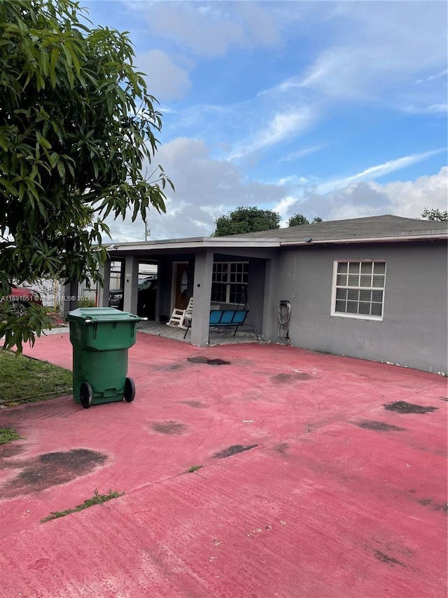 back of house with a patio area