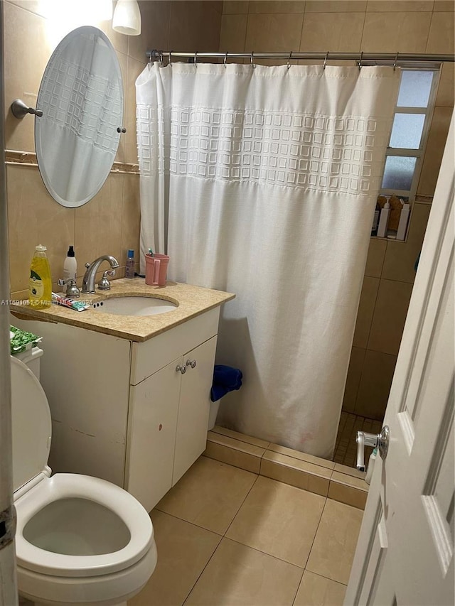 bathroom featuring vanity, tile walls, tile patterned flooring, toilet, and curtained shower