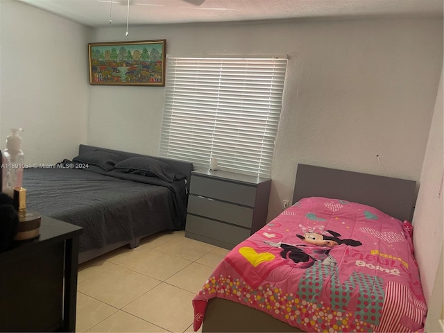 bedroom featuring light tile patterned floors