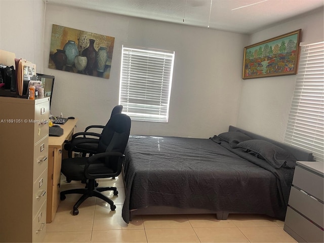 bedroom featuring light tile patterned floors