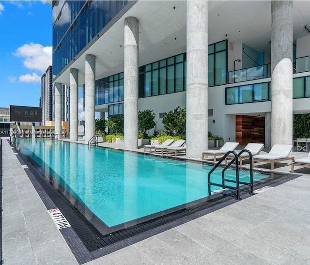 view of swimming pool with a patio area