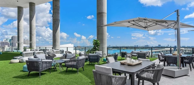 view of patio / terrace featuring outdoor lounge area and a water view