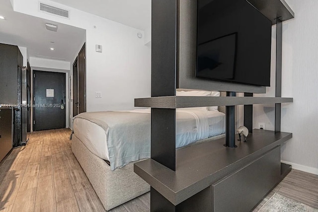 bedroom featuring light wood-type flooring