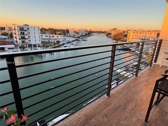 balcony at dusk with a water view