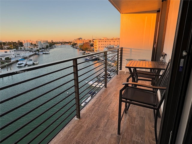 balcony at dusk with a water view