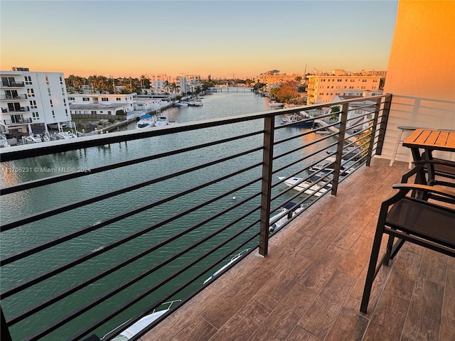 balcony at dusk with a water view