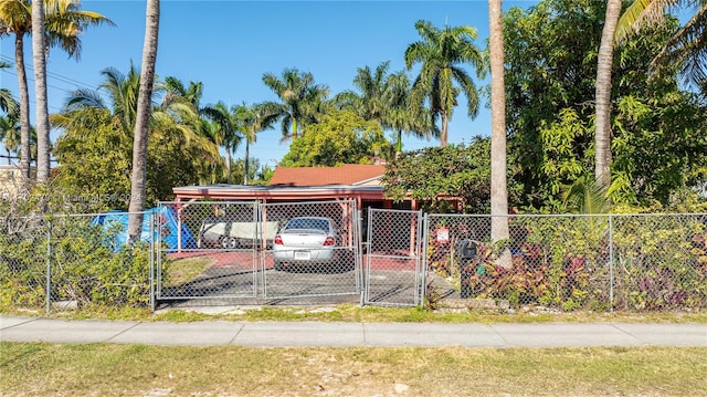 view of front of property featuring a carport