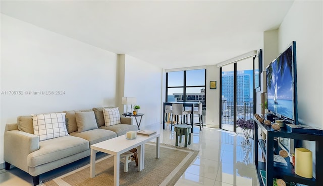 living room featuring floor to ceiling windows and light tile patterned flooring