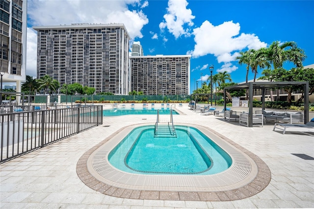 view of swimming pool featuring a patio area