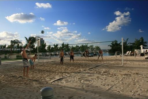 view of property's community featuring volleyball court