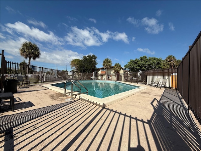 view of swimming pool with a patio