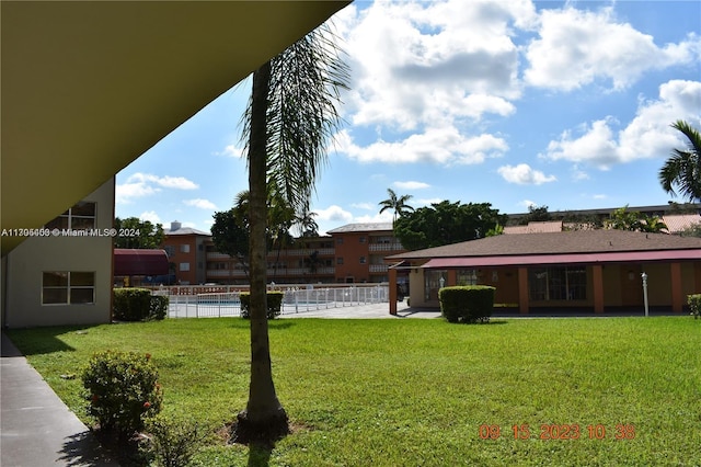 view of yard featuring a community pool