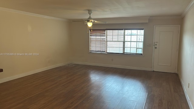 spare room featuring ceiling fan, dark hardwood / wood-style flooring, and crown molding