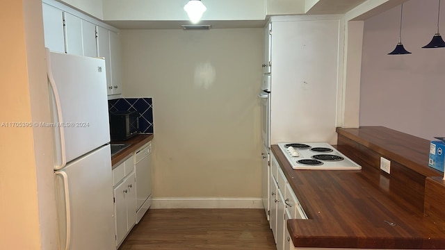 kitchen with dark wood-type flooring, butcher block countertops, decorative light fixtures, white appliances, and white cabinets