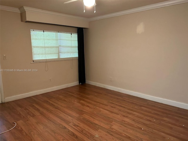 empty room featuring hardwood / wood-style floors, ceiling fan, and ornamental molding