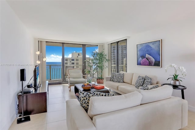 tiled living room featuring expansive windows