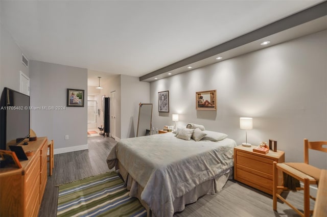 bedroom featuring hardwood / wood-style flooring