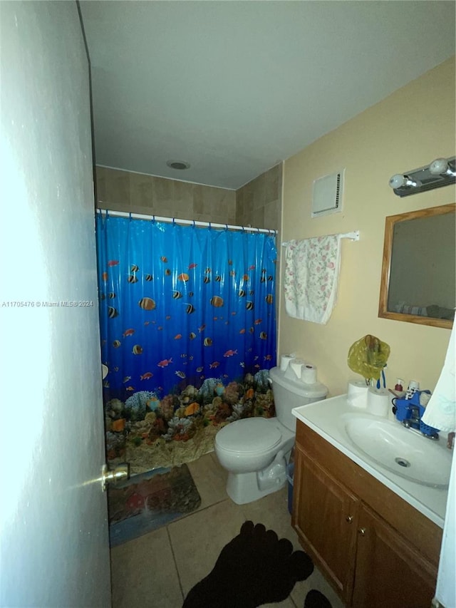 bathroom featuring tile patterned flooring, vanity, toilet, and a shower with shower curtain