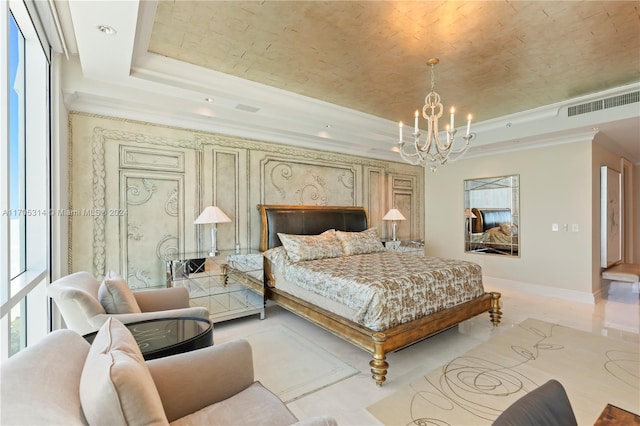 bedroom with an inviting chandelier and a raised ceiling