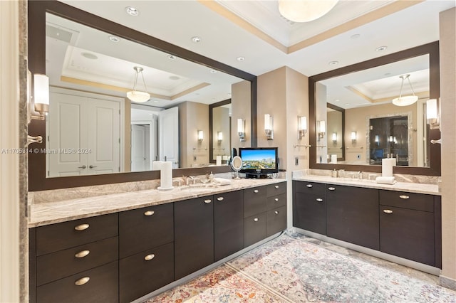 bathroom with vanity, crown molding, and a tray ceiling