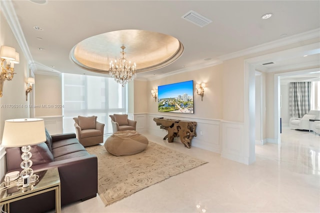 living room with a healthy amount of sunlight, ornamental molding, and a tray ceiling