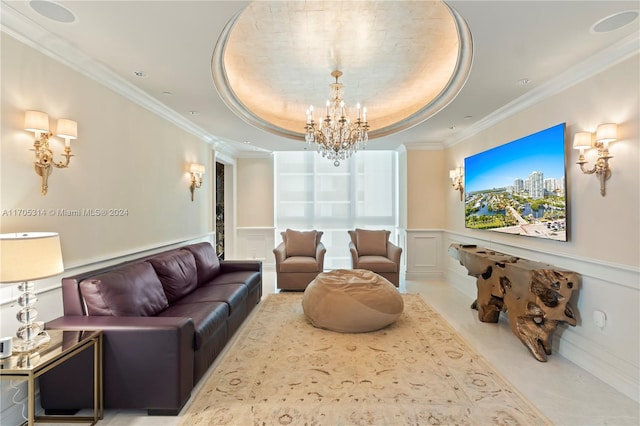 living room with a tray ceiling, crown molding, and a notable chandelier