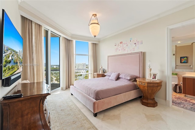 bedroom featuring ensuite bathroom and crown molding