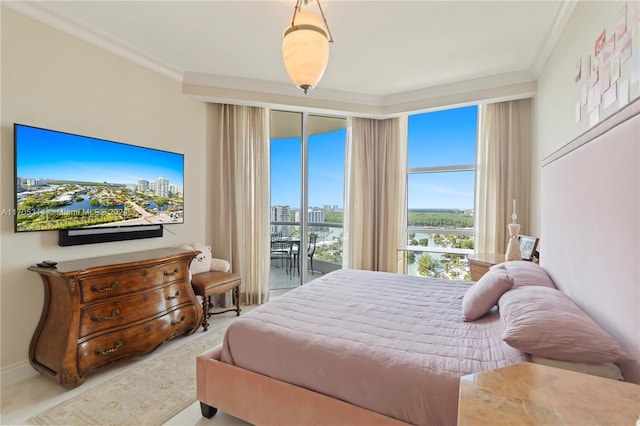 bedroom featuring access to exterior and crown molding