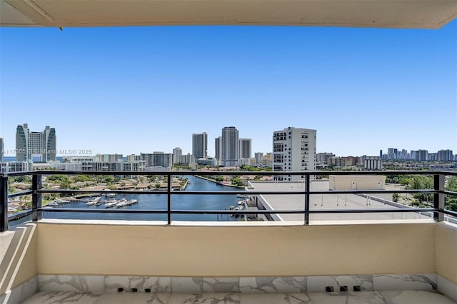 balcony featuring a water view