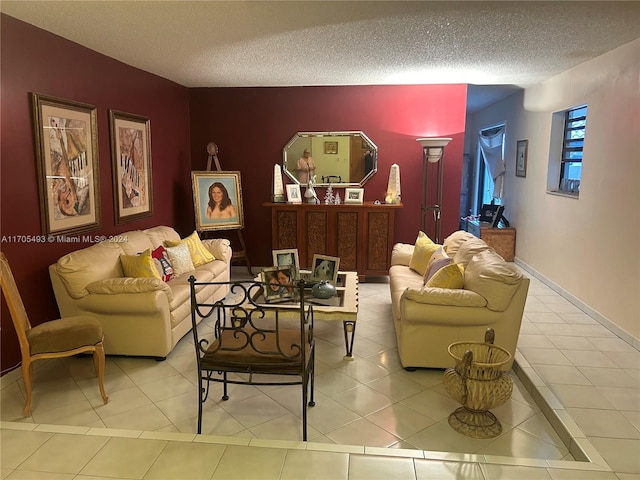 tiled living room featuring a textured ceiling