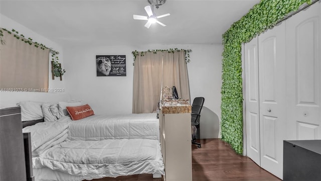 bedroom with ceiling fan and dark wood-type flooring