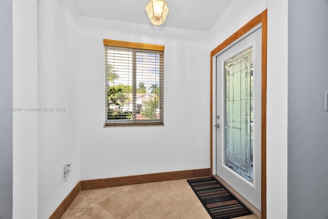 foyer featuring light tile patterned flooring