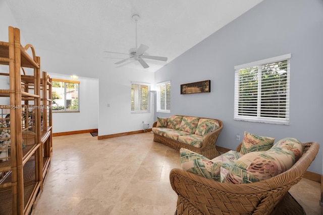 living room featuring high vaulted ceiling, ceiling fan, and a wealth of natural light