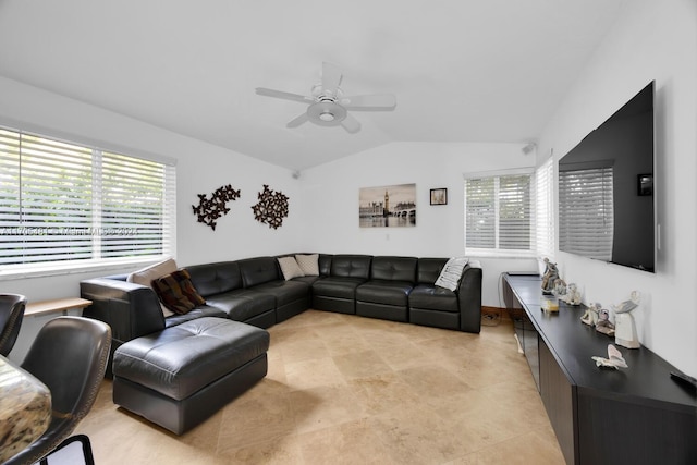 living room featuring lofted ceiling, ceiling fan, and a healthy amount of sunlight