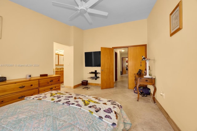 bedroom featuring ceiling fan and ensuite bath