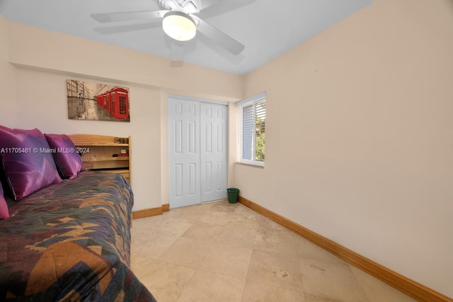 bedroom featuring ceiling fan and a closet