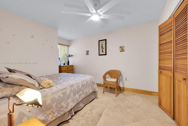 bedroom featuring ceiling fan and a closet