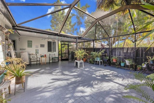 view of patio with a lanai