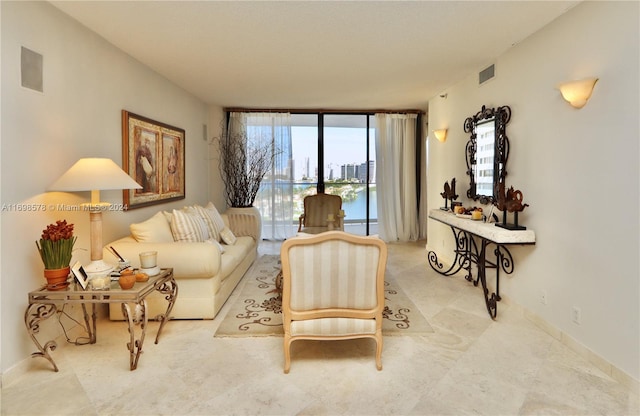 living room with floor to ceiling windows