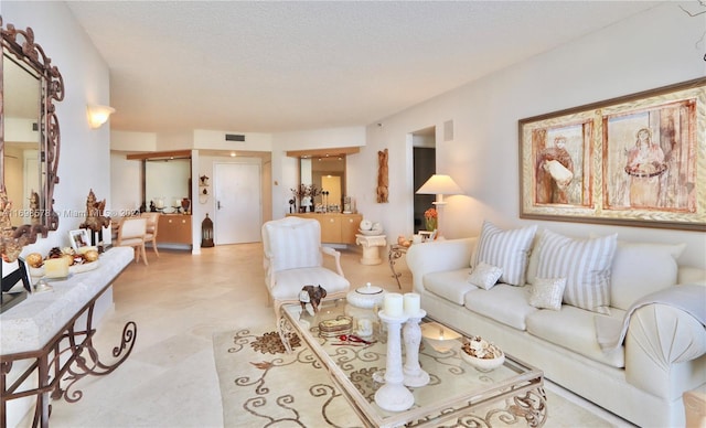 living room with a textured ceiling