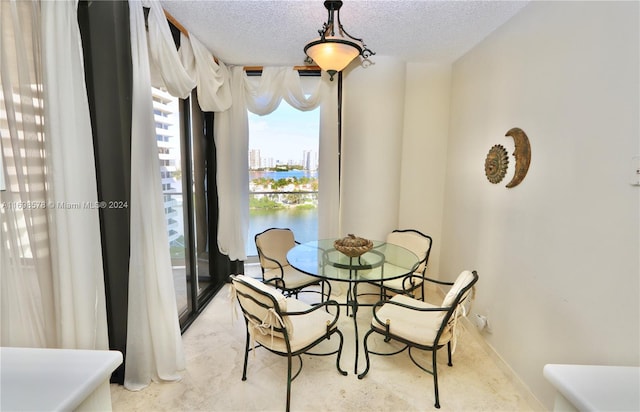 dining area with a textured ceiling