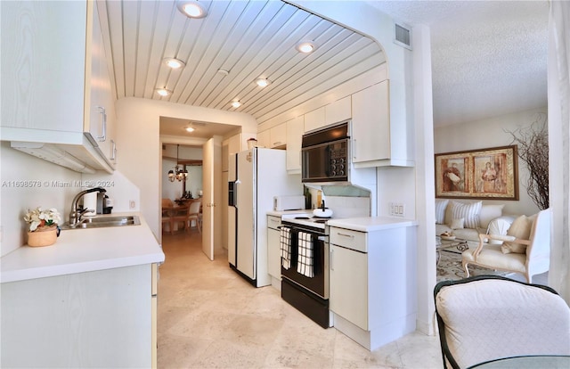 kitchen featuring black appliances, white cabinets, wooden ceiling, and sink