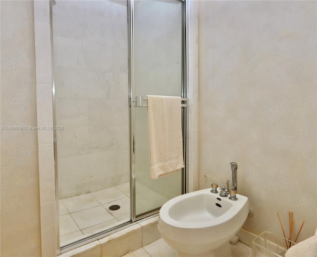 bathroom with a bidet and walk in shower