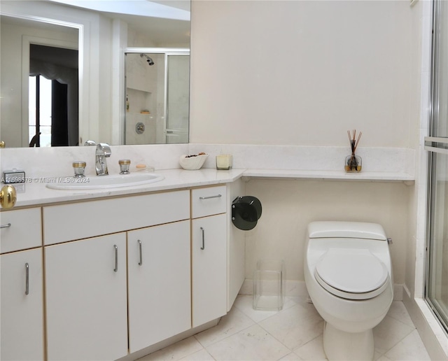 bathroom featuring tile patterned flooring, vanity, toilet, and an enclosed shower