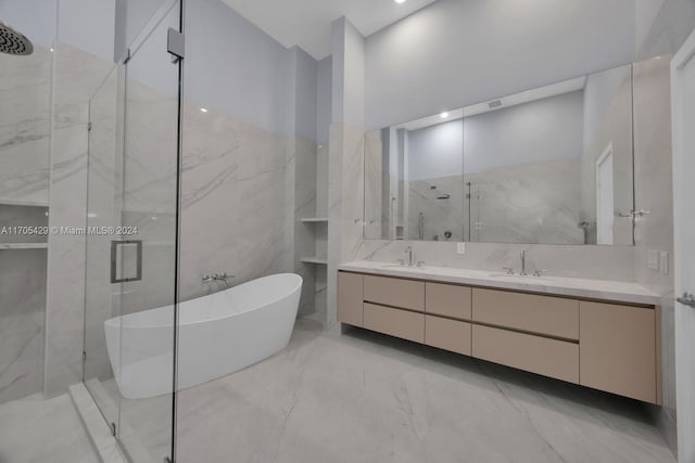 bathroom featuring vanity, separate shower and tub, and tile walls